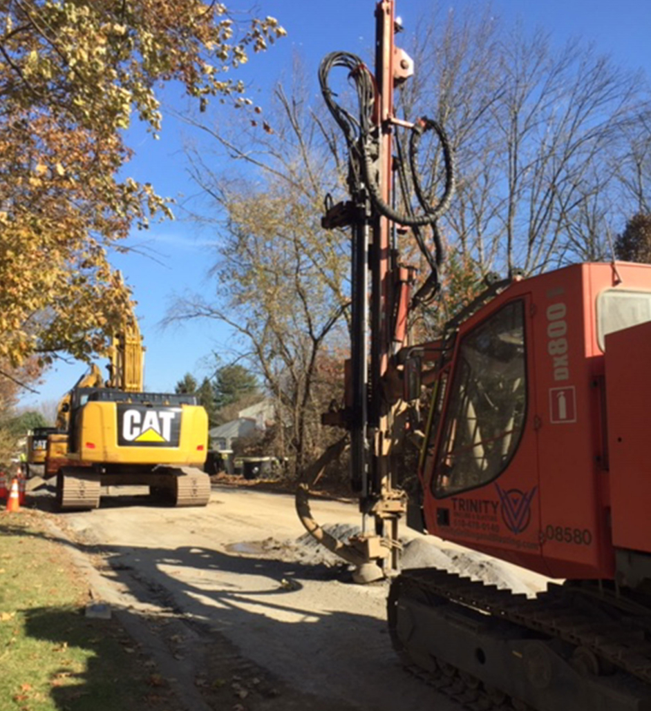 Almshouse-BCSWA Drilling and construction equipment digging into road doing utility work