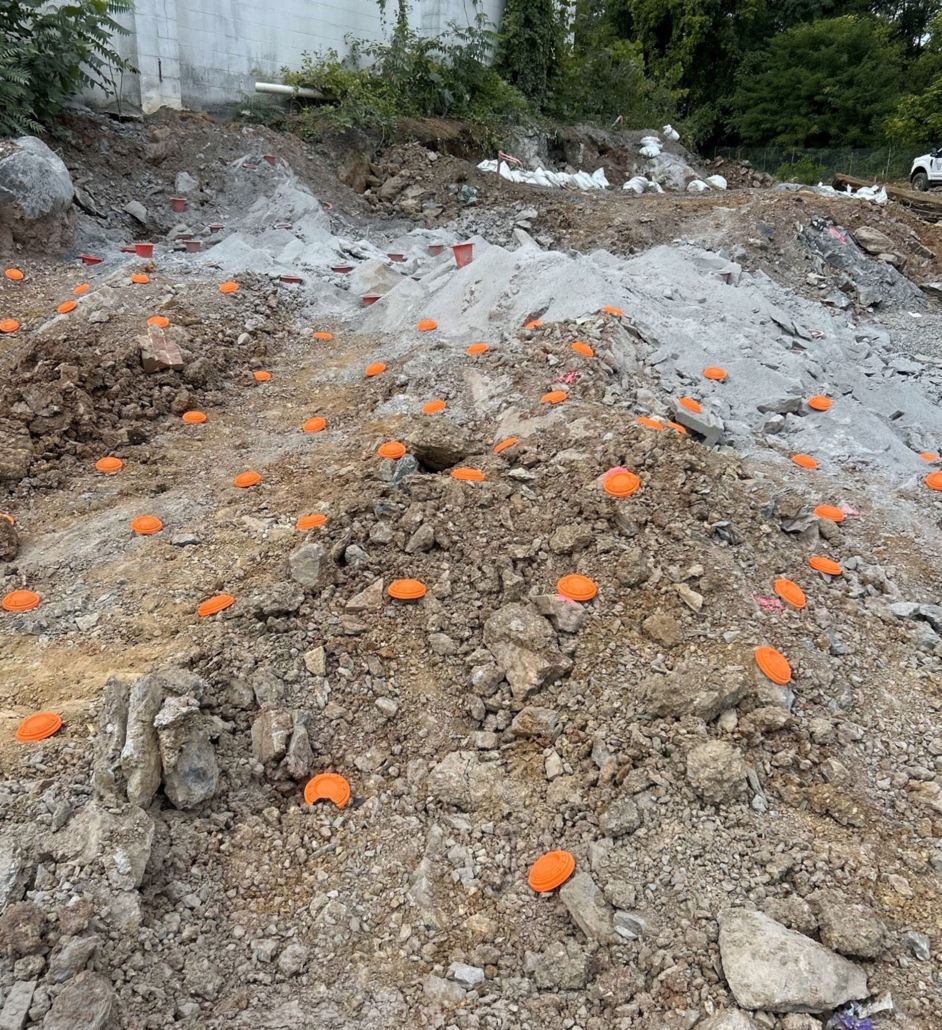 Mechanical-ground-with-flags Shot of ground at blasting site