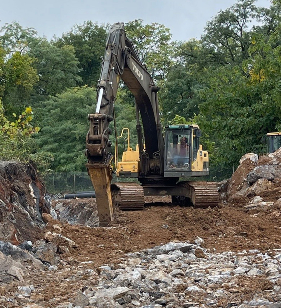 mechanical-drilling Trinity Drilling equipment digging up stones in forest